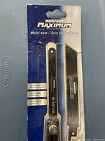 Front of packaged Mastercraft Maximum multi-saw showing handle and two blades