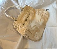 Back view with zip pocket and hardware details