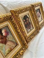 angled view showing all three framed oil portraits
