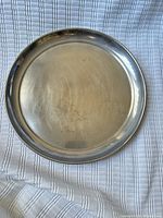 top view of round silver-tone tray