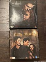 Twilight and New Moon board game boxes