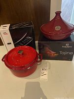 Staub cocotte and Emile Henry tajine with their original boxes