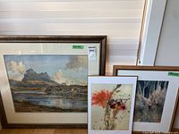 All three framed artworks standing together