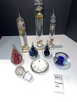 Full lot showing thermometers, paperweights, diamond, tealight holder, stopper