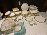 Royal Doulton Clarendon dinner service components with padded storage cases and Sutherland cream and sugar