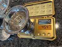 Birks sterling candle holder on scale reading 45.47 g