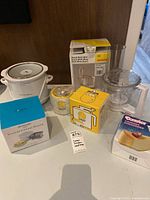 Group shot of Bosch mixer, Donvier yogurt cheese maker, Monster Half-Pint ice cream maker, Rival Little Dipper crockpot