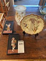 Overview: plate, vase, two framed pictures