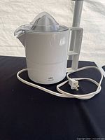 Side view of Braun Citromatic juicer showing body, handle, cord and plug