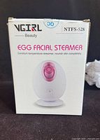 Front of VGIRL NTFS-528 facial steamer box with product image and name