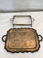 Overview of both silver-plated items on table