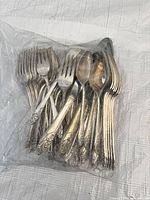 Bagged assortment of silver-plated forks and spoons