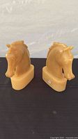 Front view of both alabaster horse head bookends