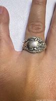 Ring worn on finger showing overall appearance and size
