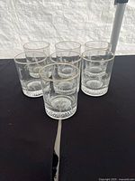 Six of the seven glasses arranged showing design, rims and bases