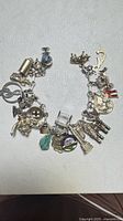 Full view of sterling charm bracelet showing all attached charms