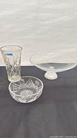 Three glass items: vase, bowl, pedestal plate