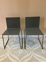 Front view of both chairs showing shell, sled bases and color