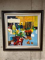 Front view of framed oil painting hung on wall