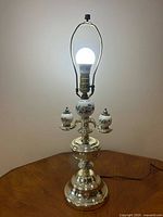 Full view of lamp with bulb to show overall design and scale