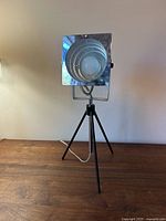 Front view showing circular grille and square bezel