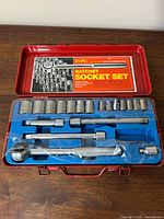 open case showing full 21-piece socket set