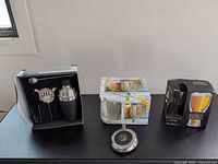 All boxed items and flask displayed