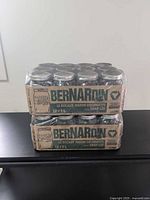 Front view of two shrink-wrapped cases of jars