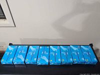 All eight boxes lined up showing front panels