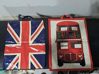 Both totes side by side showing front graphics and size comparison