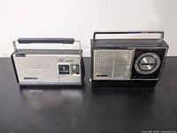 Front view of both radios showing overall design, grilles and handles