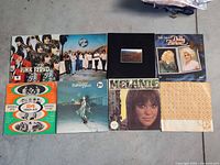 All eight LP jackets and inner sleeve laid out