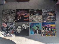 Group shot of all eight LP jackets laid out on floor