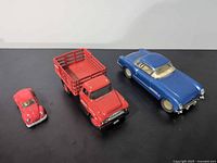 All three vehicles side by side showing scale and condition