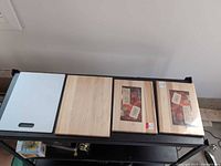 All four cutting boards aligned on table