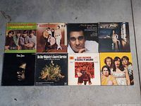 All eight album fronts laid out for identification