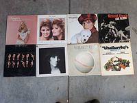 All eight album covers laid out for identification