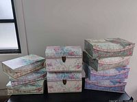 All eight floral boxes displayed in three stacks