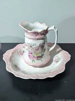 pitcher seated in basin, top view showing scalloped rims and rose decals