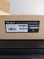 Box label showing Targus USB-C Dual 4K Docking Station 100W PD, model and SKU
