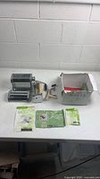 overview of pasta machine, attachments, box, manuals