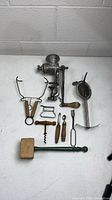 All antique kitchen tools laid out on tabletop