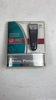 Front of sealed Logitech Cordless 2.4 GHz Presenter retail package