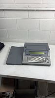 Full view of word processor with keyboard cover open