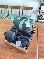 Overview of all cameras, lenses, bags and accessories on tray