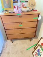Front view of four-drawer wooden dresser