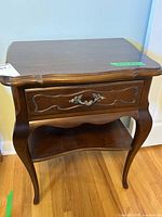 Front view of Gibbard side table showing drawer, shelf, legs
