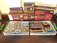 Overall lot with boxed rolling stock, track sets and controller
