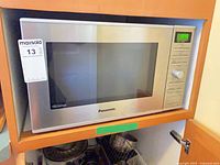 Front view of Panasonic microwave showing stainless steel door and control panel