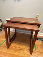 Both teak nesting tables stacked